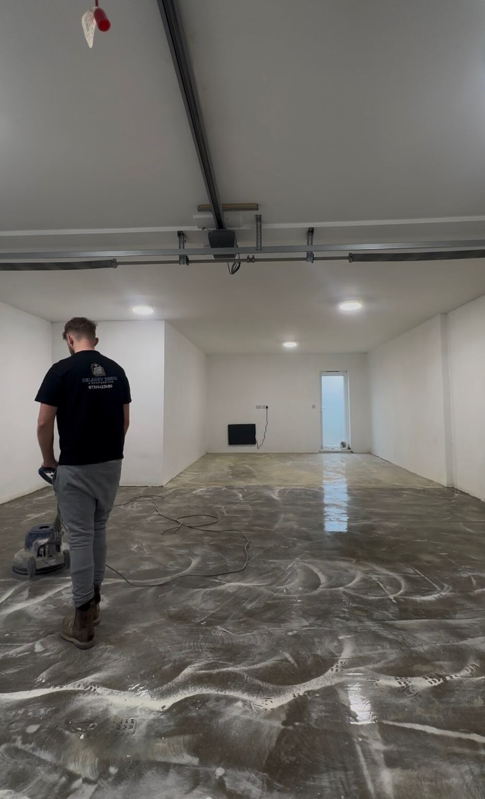Double-garage floor during surface preparation