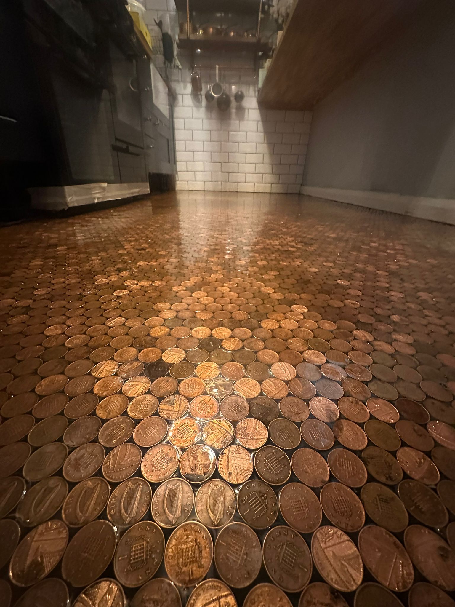 Close view of mixed copper coins encapsulated in clear resin