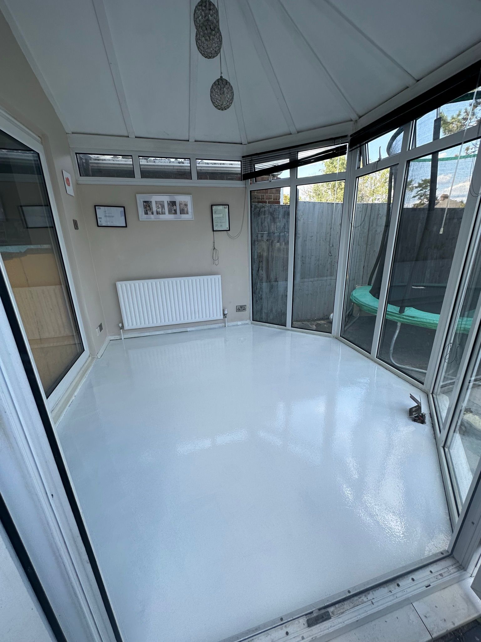 White floor in a bright conservatory